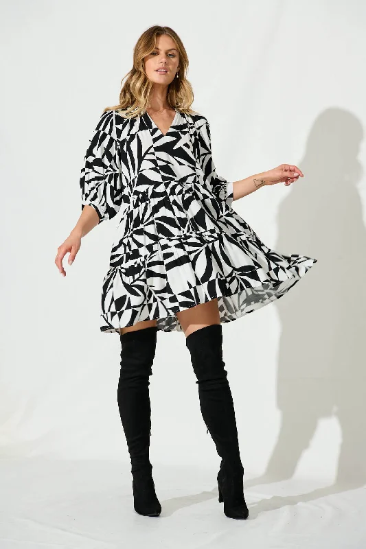 Debby Smock Dress In White With Black Print Must-have floral dresses for this season