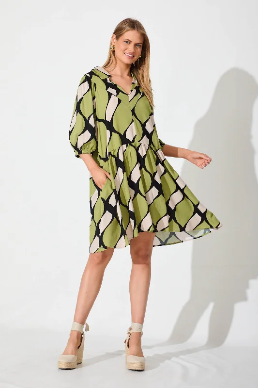 Forrest Smock Dress In Green With Black And White Print Must-have floral dresses for this season